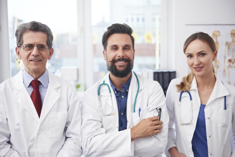 Portrait of three doctors with a smile on their face